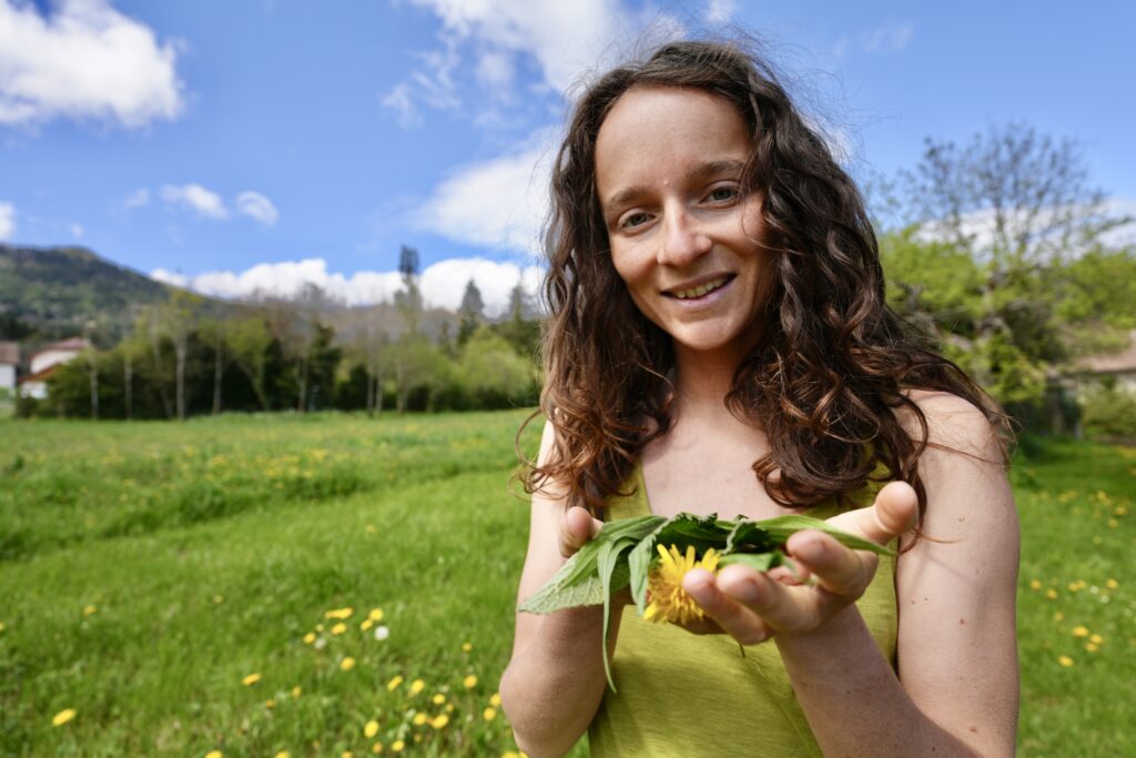 Eve foraging for edible plants to add to the salad